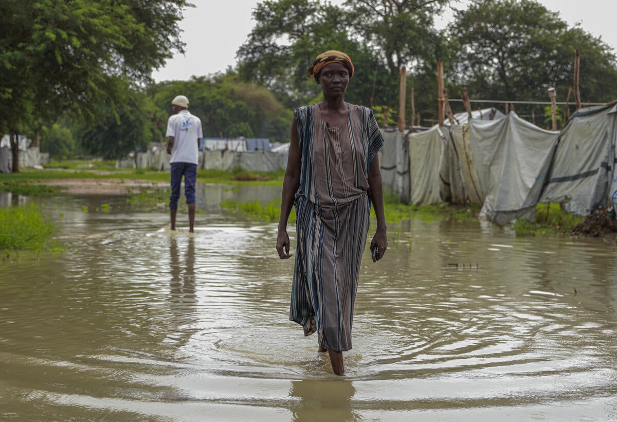 An Internally Displaced Person, Nyaguen Koang Garang, 39, walks in a flooded camp for the Internally Displaced Person in Bor, South Sudan. South Sudan. Severe floods worsens plight for thousands displaced by conflict