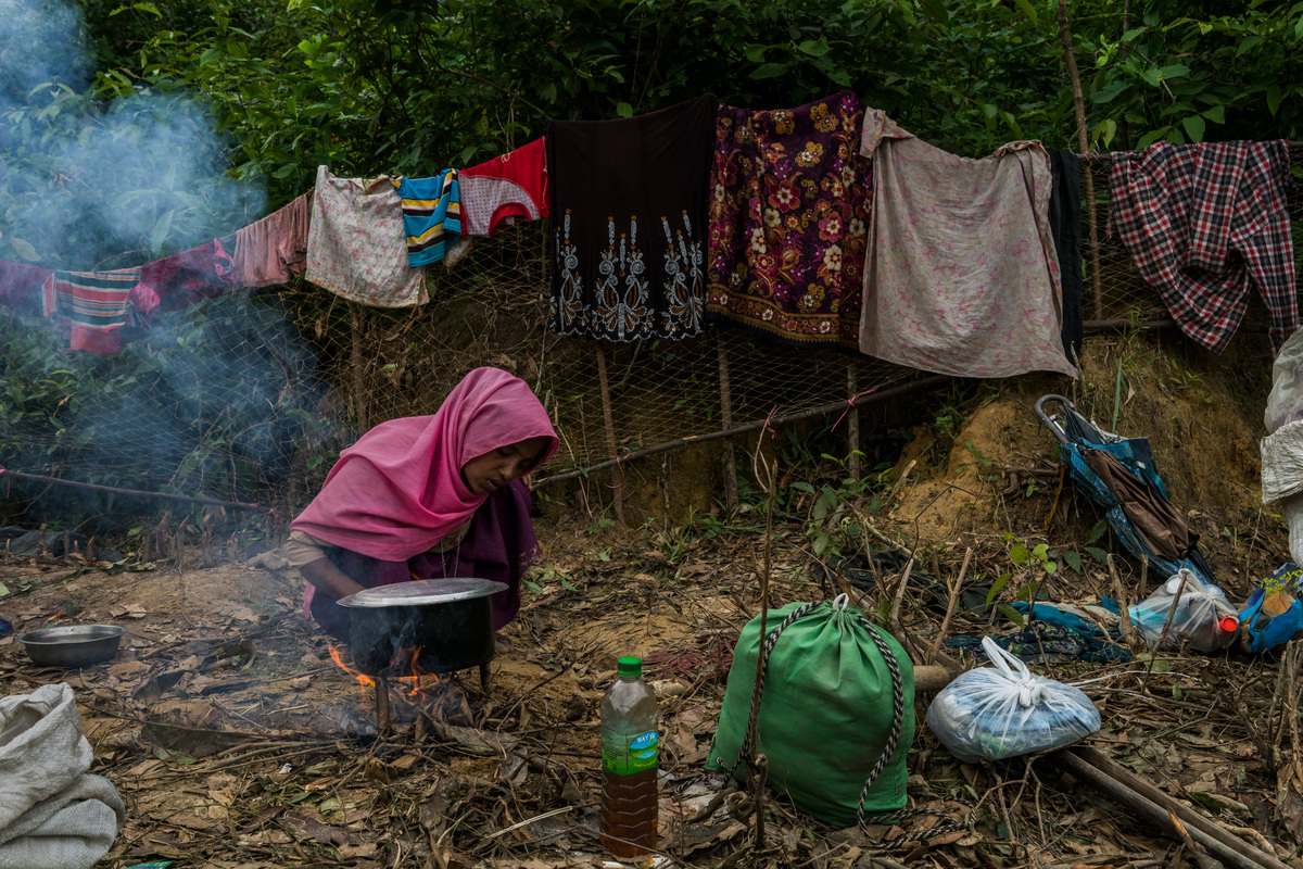 Bangladesh. A Rohingya refugee family lives on the side of the road without shelter