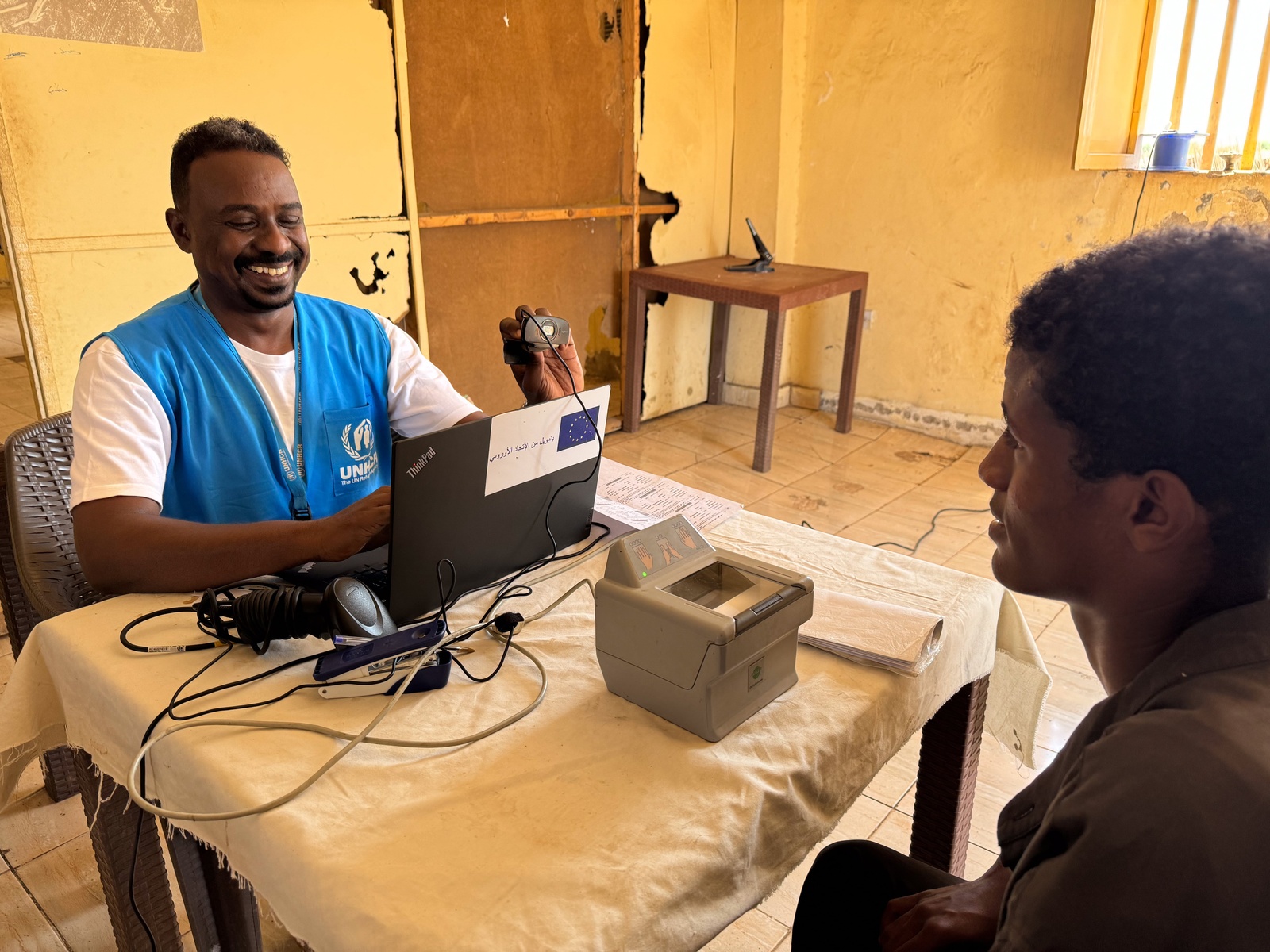 Refugees and asylum-seekers undergo registration at a UNHCR registration desk in Um Gargour camp in Sudan's Gedaref State.