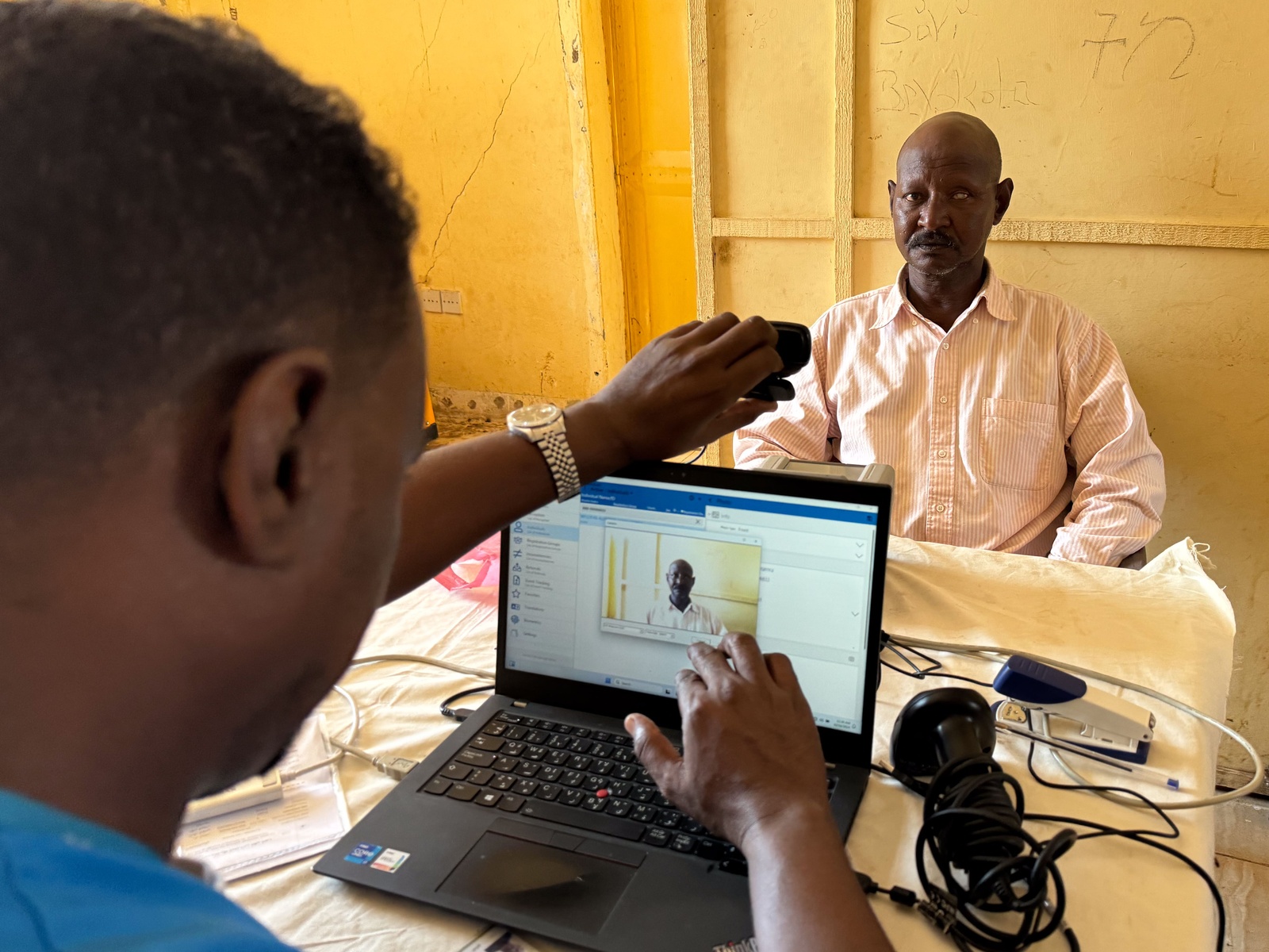 Haile renews his refugee ID at a UNHCR registration desk in Sudan's Gedaref state