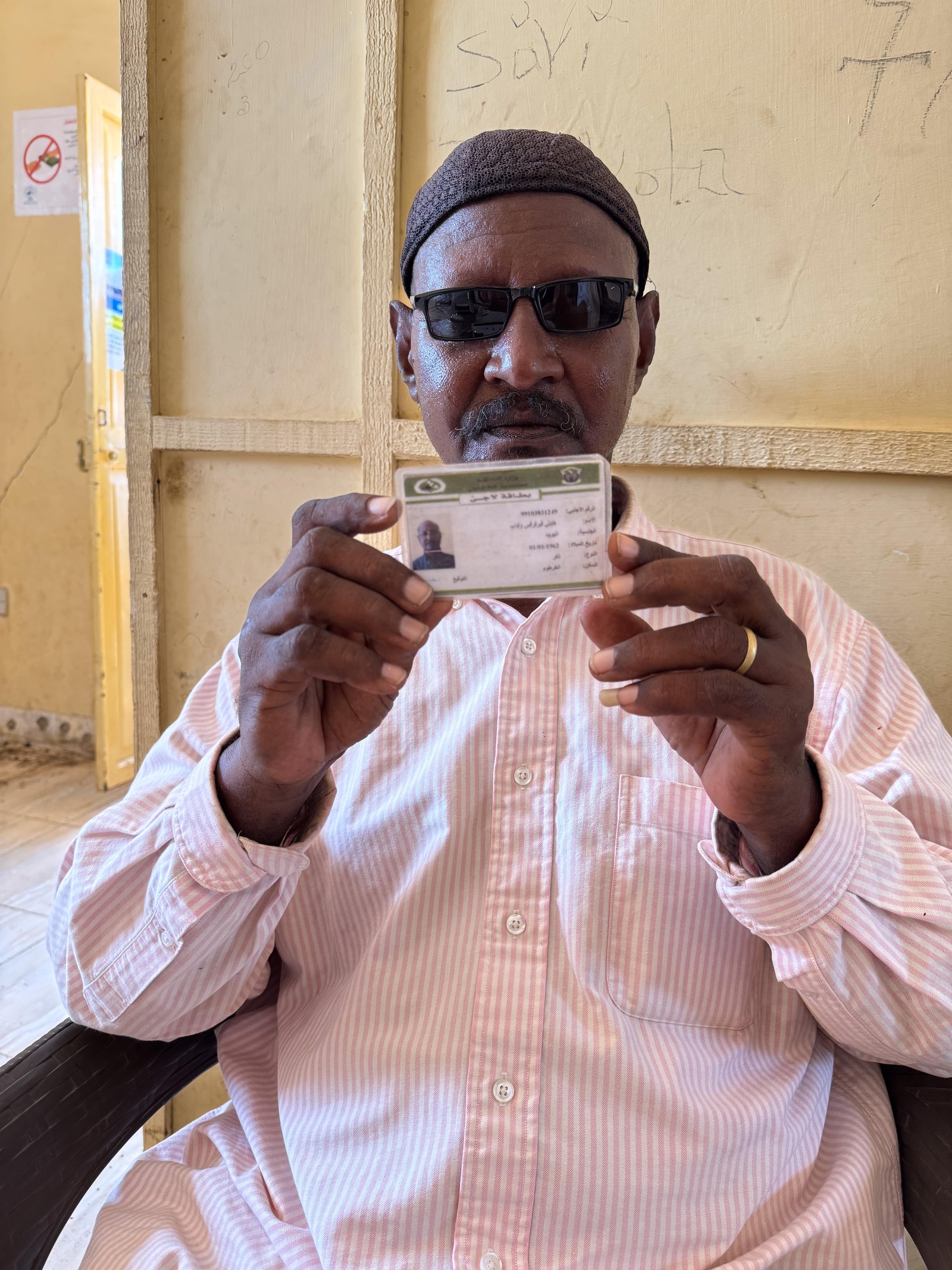 Haile renews his refugee ID at a UNHCR registration desk in Sudan's Gedaref state