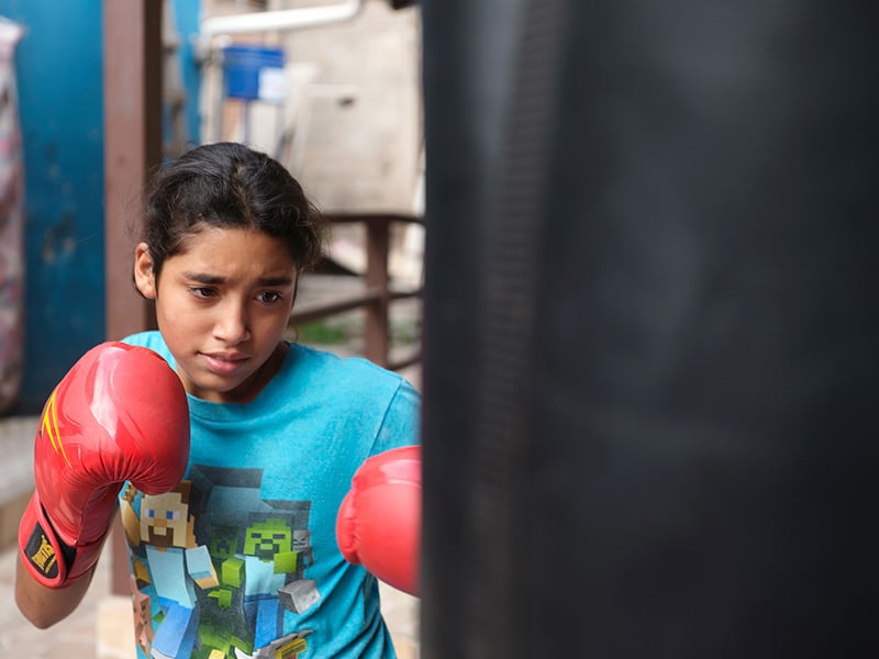 Tegucigalpa, Honduras: Fernanda from the San Miguel community centre boxing club using sports as a girl and women empowerment and violence prevention tool.