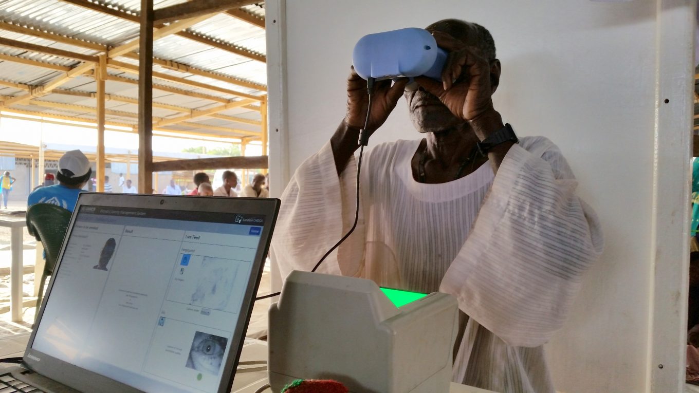 UNHCR 2015/ S.A. Jefferies / A Sudanese father and refugee provides biometrics during registration in Goz Amir camp, Chad.
