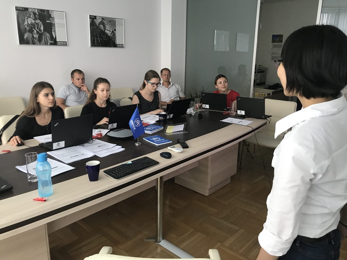 © UNHCR/ Charlotte Arnaud / Partners from the Belarusian NGO Refugee Counseling Service and UNHCR staff are experimenting in the training environment of the software under the guidance of Hau Yan Wan from the deployment team.