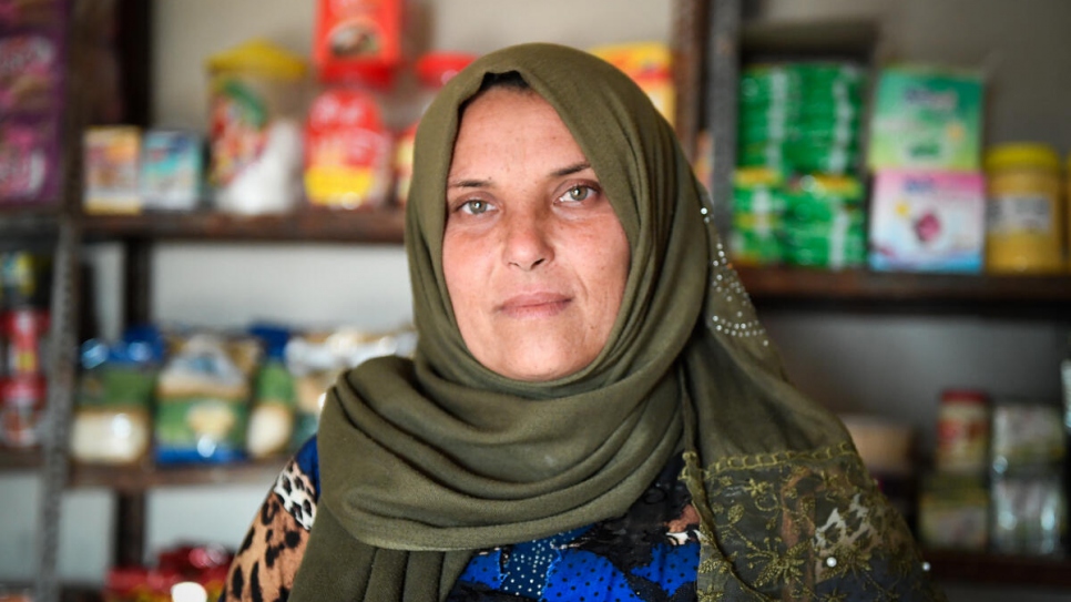 Abeer stands in the mini market she opened with the help of a small business grant funded by UNHCR_UNHCR_Bassam Diab