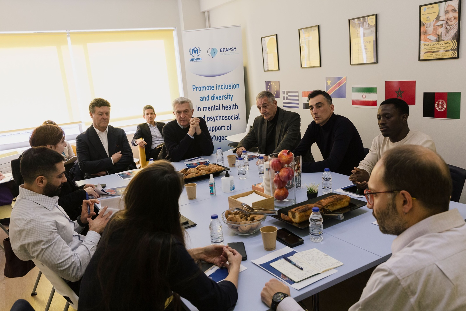 The United Nations High Commissioner for Refugees, Filippo Grandi, the UNHCR Regional Director for Europe, Philippe Leclerc, and the UNHCR Representative in Greece, Maria Clara Martin, during a meeting with counselors of the UNHCR-funded community psychosocial support project EPAPSY.