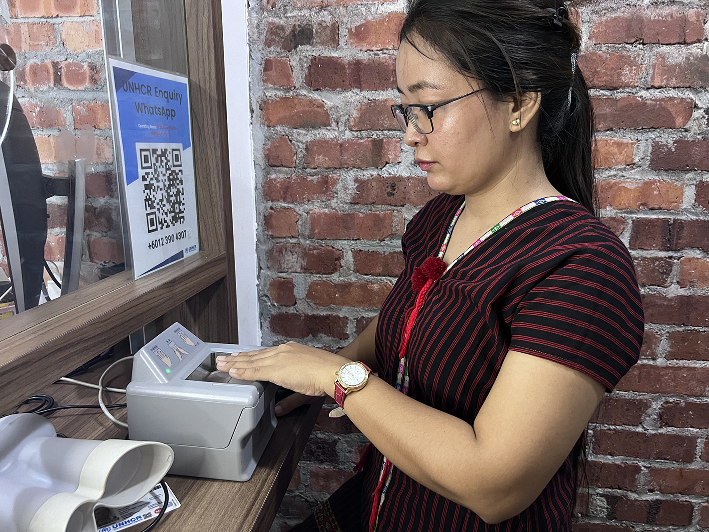 “I was 16 years old, and I was very nervous to use the machine,” she said, referring to the biometrics scanner used in UNHCR’s biometric identity management system.  Today, renewing her UNHCR card and using the biometrics scanner is routine.