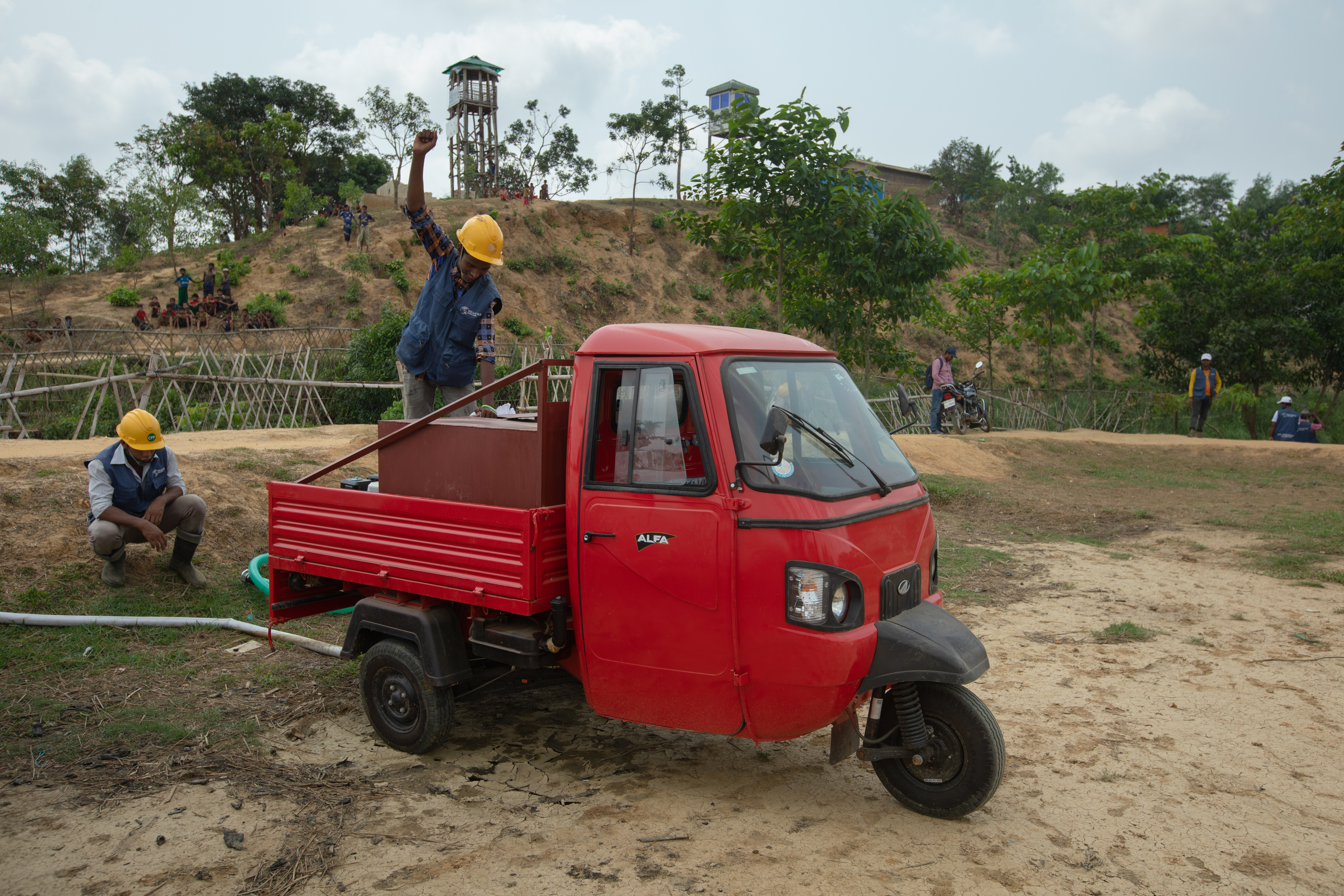 Bangladesh. Rohingya refugee fire fighter team constructing a house for the training on how to mitigate fire during fire outbreaks