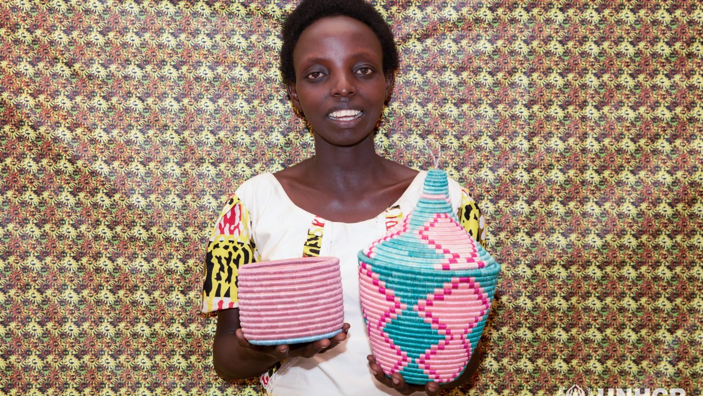 Rwanda. Francoise is a member of a group of Burundian refugee women from Mahama Camp in Rwanda who come together to produce crafts, baskets, bags, dresses, bedspreads and dishes.