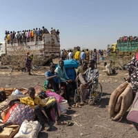 Refugees from Sudan wait at the Joda border point in South Sudan's Upper Nile State for transportation to the transit centre in Renk.