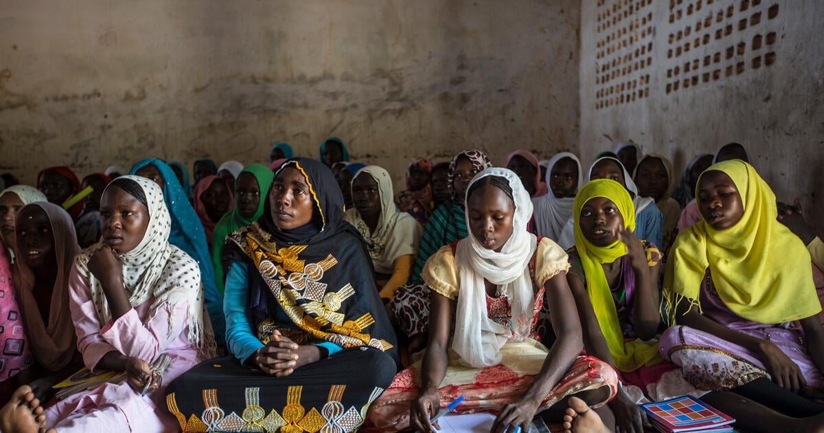 Sudanese Mother Joins Her Own Children In Class 