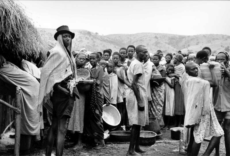 As colonialism came to a close, conflicts erupted in many parts of Africa in the 1960s including, not for the last time, strife in the central African state of Rwanda.  This group of Rwandese is seen waiting for the distribution of food at a refugee centre in Uganda's Oruchinga Valley.  