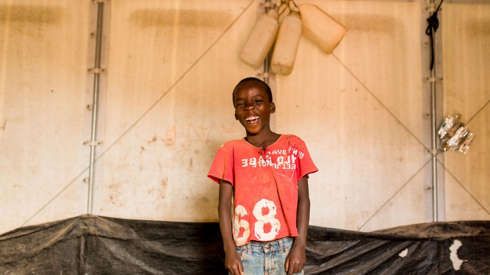 A child laughs at Kigoma refugee camp in Tanzania.